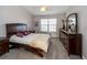 Comfortable bedroom with a queen-size bed and dresser at 17546 Fairmeadow Dr, Tampa, FL 33647