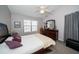 Spacious bedroom with a dresser and window coverings at 17546 Fairmeadow Dr, Tampa, FL 33647
