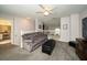 Relaxing bonus room featuring a gray couch and ottoman at 17546 Fairmeadow Dr, Tampa, FL 33647