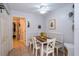 Bright breakfast nook with wood table and white chairs at 17546 Fairmeadow Dr, Tampa, FL 33647
