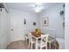 Bright breakfast nook with wood table and white chairs at 17546 Fairmeadow Dr, Tampa, FL 33647