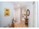 Inviting entryway with views into the kitchen and a decorative table at 17546 Fairmeadow Dr, Tampa, FL 33647
