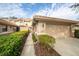 Attached garage with driveway and well-manicured landscaping at 17546 Fairmeadow Dr, Tampa, FL 33647