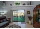 Living room with sliding doors leading to a screened patio at 17546 Fairmeadow Dr, Tampa, FL 33647