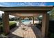 Community pool with covered seating area and lounge chairs at 17546 Fairmeadow Dr, Tampa, FL 33647