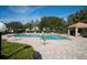 Inviting community pool with ample lounge chairs at 17546 Fairmeadow Dr, Tampa, FL 33647