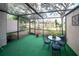 Relaxing screened patio with seating and potted plants at 17546 Fairmeadow Dr, Tampa, FL 33647