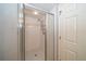Walk-in shower with glass enclosure at 17546 Fairmeadow Dr, Tampa, FL 33647