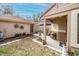 Landscaped side yard with a small patio and seating area at 17546 Fairmeadow Dr, Tampa, FL 33647