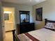 Bedroom with a double bed, dresser, and en-suite bathroom at 1799 N Highland Ave # 44, Clearwater, FL 33755