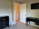 Bedroom with a dresser, desk, and access to other rooms at 1799 N Highland Ave # 44, Clearwater, FL 33755