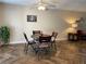 Cozy dining area with wood-look floors and a round table with four chairs at 1799 N Highland Ave # 44, Clearwater, FL 33755