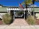 Community entrance with gate and pergola at 1799 N Highland Ave # 44, Clearwater, FL 33755