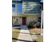 Inviting condo entry with red door and well-manicured landscaping at 1799 N Highland Ave # 44, Clearwater, FL 33755