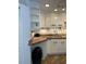 White cabinets, granite countertops, and a double sink characterize this kitchen at 1799 N Highland Ave # 44, Clearwater, FL 33755