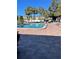 Community pool with lounge chairs at 1799 N Highland Ave # 44, Clearwater, FL 33755