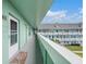 Light green hallway with white door and small rug at 2043 Denmark St # 65, Clearwater, FL 33763