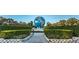 Entrance to community with globe feature at 2043 Denmark St # 65, Clearwater, FL 33763