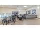 Community lounge with tables, chairs, and a bar area at 2043 Denmark St # 65, Clearwater, FL 33763