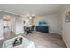 Living room with dining area, TV, and access to patio at 2043 Denmark St # 65, Clearwater, FL 33763