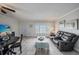 Living room with dining area, TV, and access to patio at 2043 Denmark St # 65, Clearwater, FL 33763
