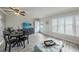 Living room with dining area, TV, and access to patio at 2043 Denmark St # 65, Clearwater, FL 33763