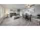 Bright living room features tile floors, comfortable seating and a dining area at 2043 Denmark St # 65, Clearwater, FL 33763