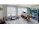Home office with wood desk, built-in shelving, and plenty of natural light at 2043 Denmark St # 65, Clearwater, FL 33763
