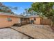 Backyard with gravel, deck, and wooden fence at 2201 Park N St, St Petersburg, FL 33710