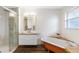 Updated bathroom features a clawfoot tub, double vanity, and walk-in shower at 2201 Park N St, St Petersburg, FL 33710