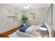 Bright bedroom with hardwood floors and ceiling fan at 2201 Park N St, St Petersburg, FL 33710