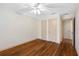 Bright bedroom with hardwood floors, ceiling fan, and built-in dresser at 2201 Park N St, St Petersburg, FL 33710