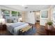 Main bedroom with light walls and sliding barn door to bathroom at 2201 Park N St, St Petersburg, FL 33710