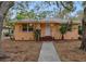 Quaint house with a walkway and mature trees at 2201 Park N St, St Petersburg, FL 33710