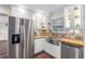 Modern kitchen with butcher block countertops and stainless steel appliances at 2201 Park N St, St Petersburg, FL 33710