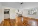 Bright living room with hardwood floors and a view into the kitchen at 2201 Park N St, St Petersburg, FL 33710