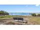 Park bench overlooking the water with distant cityscape at 2201 Park N St, St Petersburg, FL 33710