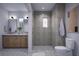Elegant bathroom with double vanity, marble countertops, and a large walk-in shower at 2550 1St N Ave, St Petersburg, FL 33713