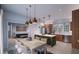 Modern kitchen with island, stainless steel appliances, and dining area at 2550 1St N Ave, St Petersburg, FL 33713