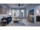 Living room with hardwood floors, a comfortable seating area and large windows at 2550 1St N Ave, St Petersburg, FL 33713