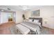 Virtually staged bedroom with a king-size bed and decor at 2587 Countryside Blvd # 6303, Clearwater, FL 33761