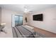 Virtually staged bedroom with a TV and decor at 2587 Countryside Blvd # 6303, Clearwater, FL 33761