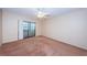 Bedroom with sliding glass doors to a balcony at 2587 Countryside Blvd # 6303, Clearwater, FL 33761