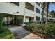 Exterior view of building with landscaping at 2587 Countryside Blvd # 6303, Clearwater, FL 33761