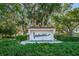 Community entrance sign with lush landscaping at 2587 Countryside Blvd # 6303, Clearwater, FL 33761