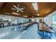 Community room with tables, chairs, and kitchen at 2587 Countryside Blvd # 6303, Clearwater, FL 33761