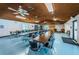 Spacious community room with tables, chairs, and a piano at 2587 Countryside Blvd # 6303, Clearwater, FL 33761