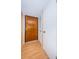 Condo entryway with wood door and light wood flooring at 2587 Countryside Blvd # 6303, Clearwater, FL 33761