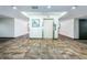 Clean condo hallway with elevator access and tiled floors at 2587 Countryside Blvd # 6303, Clearwater, FL 33761