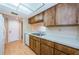 Clean kitchen with wood cabinets and double sink at 2587 Countryside Blvd # 6303, Clearwater, FL 33761